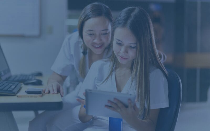 Health care workers looking at ipad