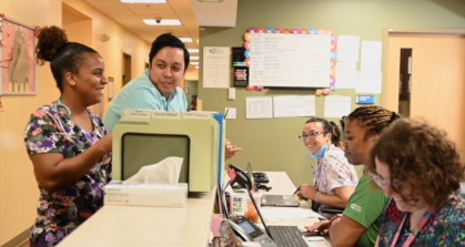 Healthcare team members discussing a case.