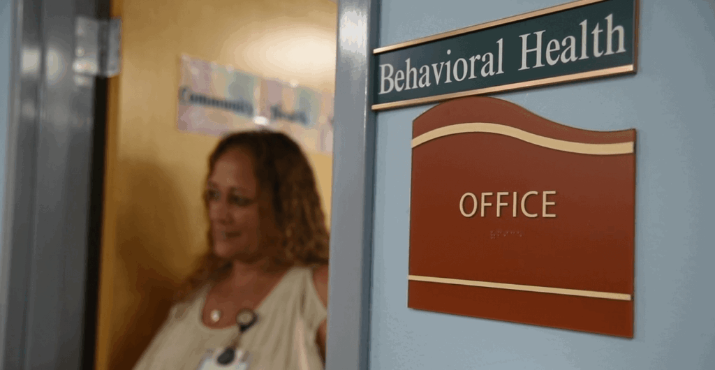 BHC in doorway of behavioral health office